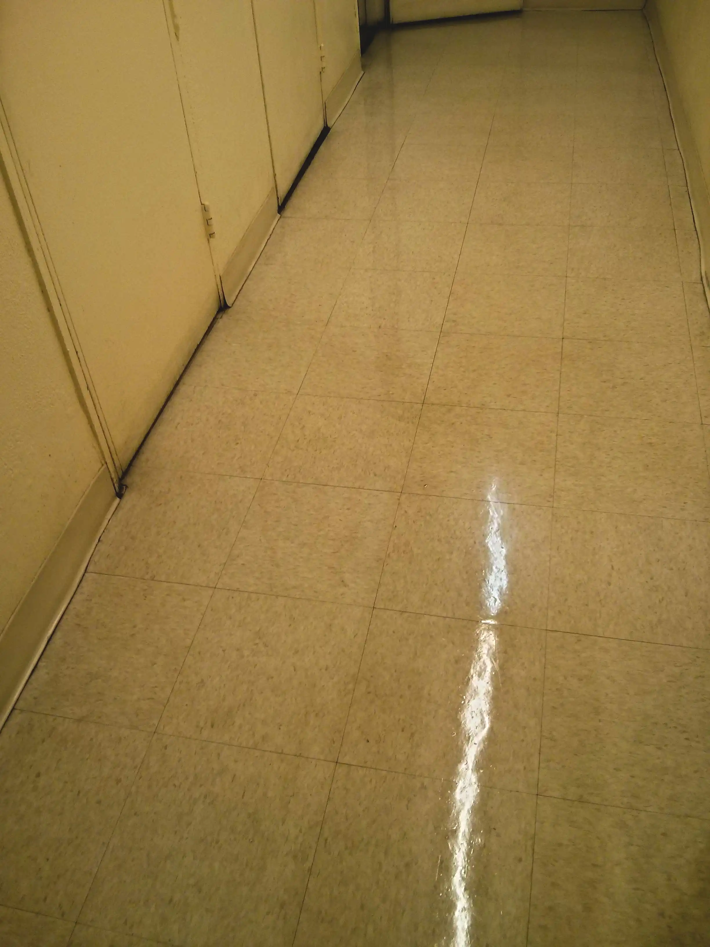 very-old-vct-tile-floor-stripped-sealed-and-clear-coat-finished-in-minneapolis