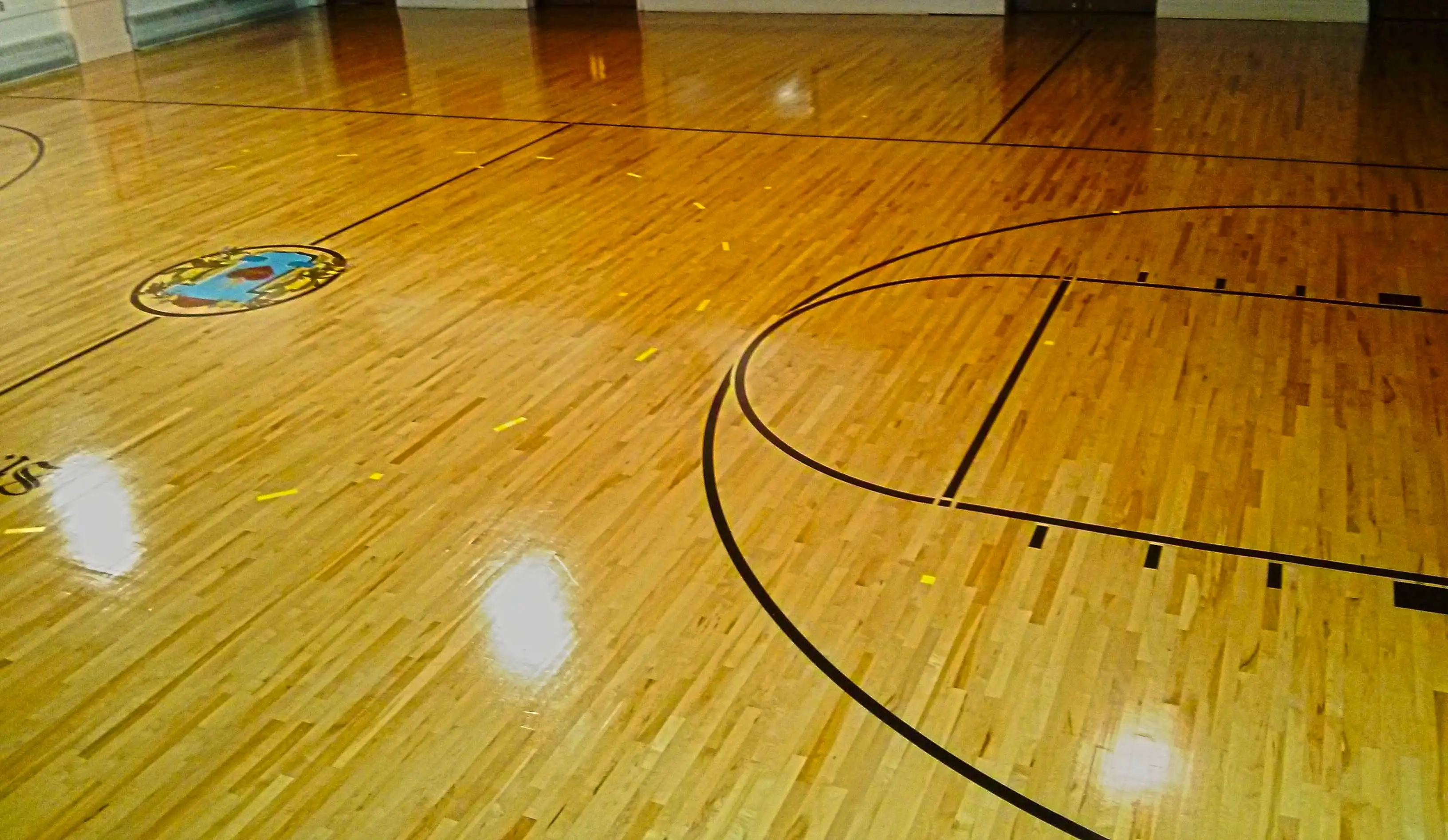 wood-gym-floor-scrub-and-clear-high-gloss-gym-coating-services-in-minneapolis-mn