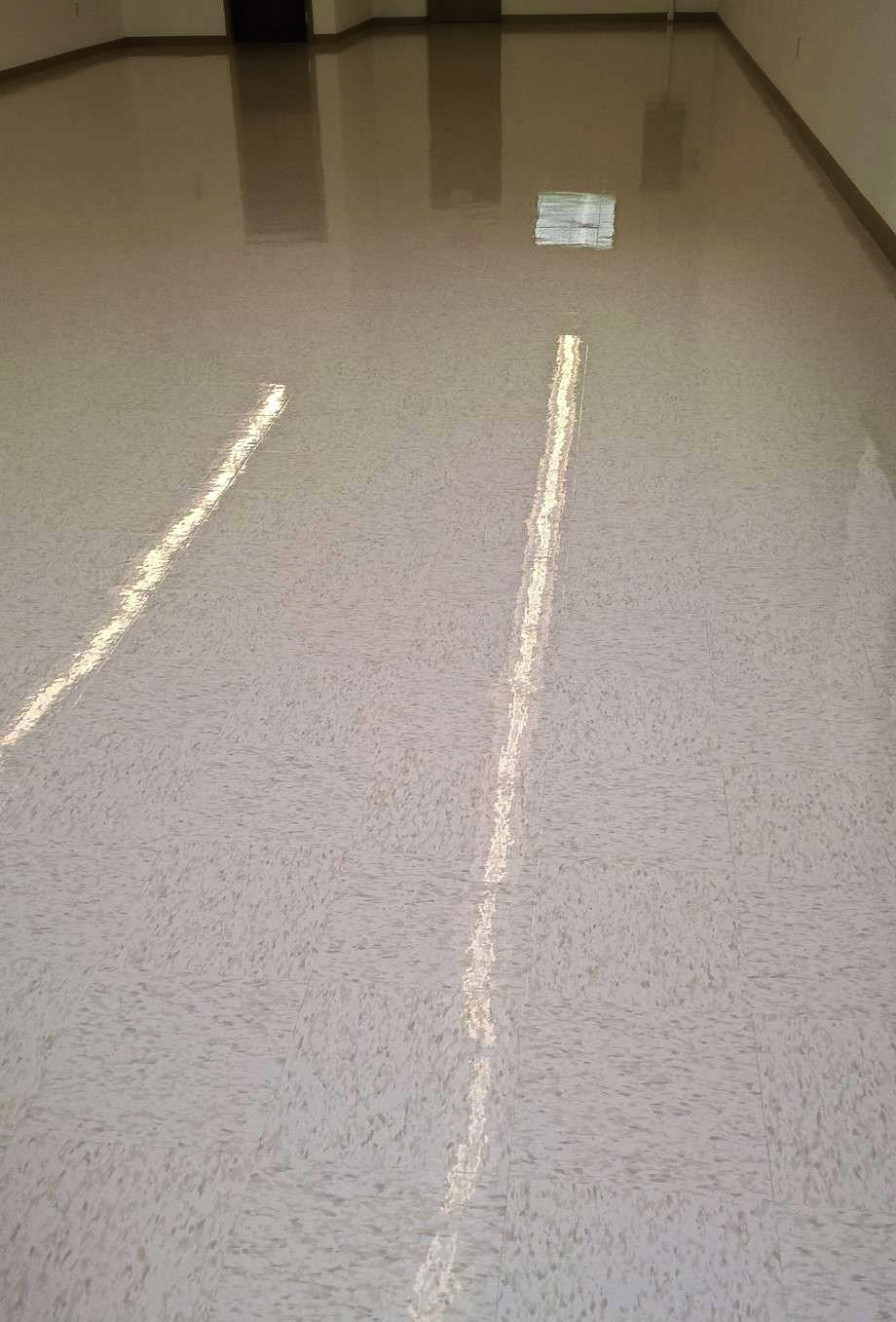 Sealer and Clear Coat Finish Put on New VCT Floor in Remodeled Retail Store image 1